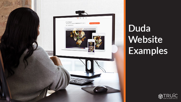 Woman working on computer with Duda example website on screen.