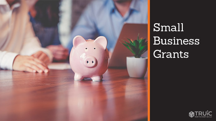 Business people with a piggy bank.