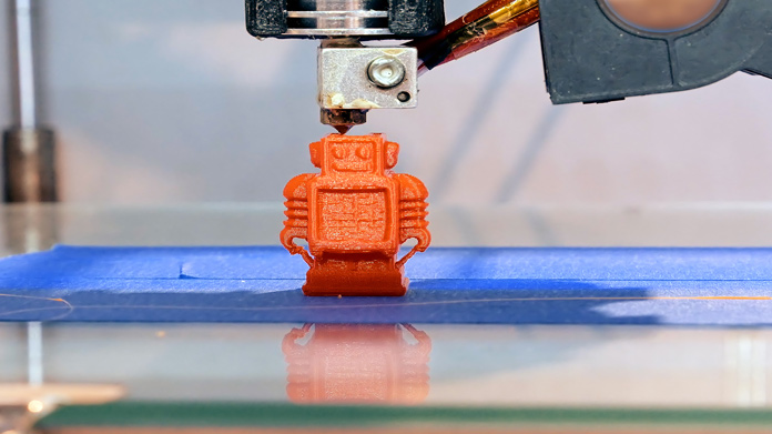 A tiny robot model being 3d printed
