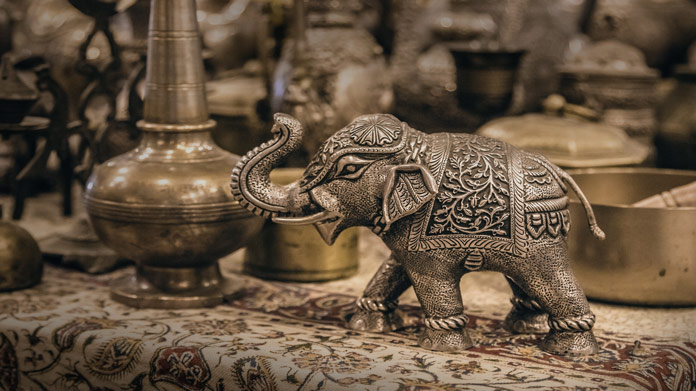 brass items and figurines at an antique store
