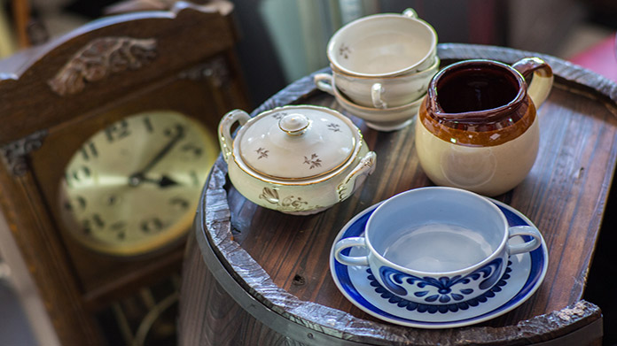 interior decor and ceramic mugs at an estate sale