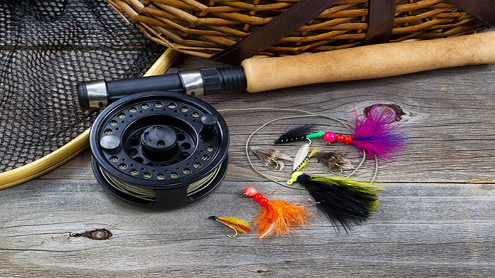Fishing reel and an assortment of colorful fishing lures