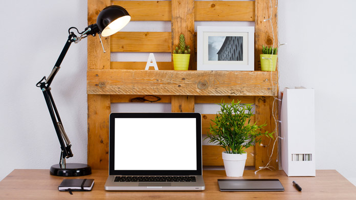 A pallet-turned-shelf on a desk