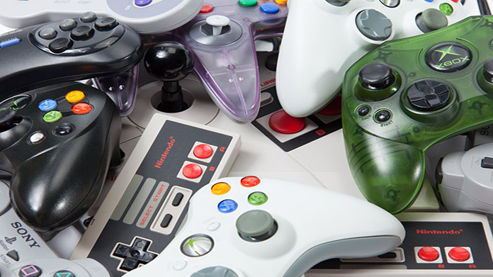 A pile of gaming controllers