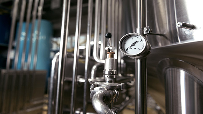 Metal pipes and a gauge of brewing tanks