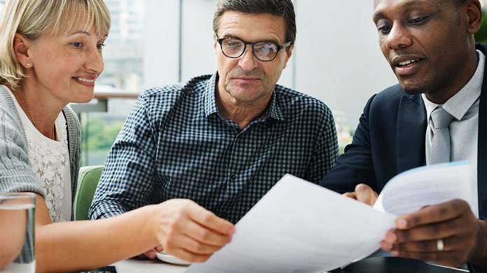 A group of people figuring out a mortgage