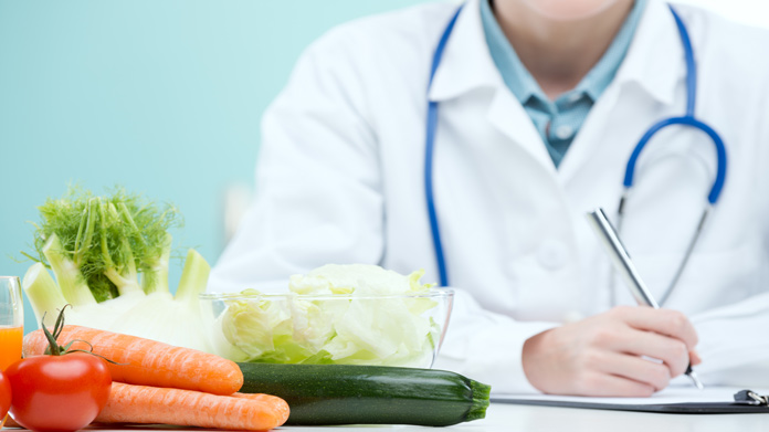 vegetables on a table in front of a Nutritionist