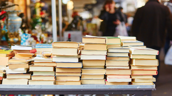 Piles of used books on a table