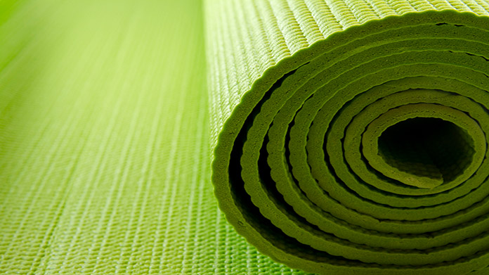 A rolled-up yoga mat