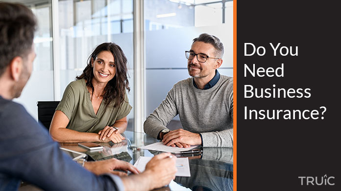 Two people meeting with an insurance agent.