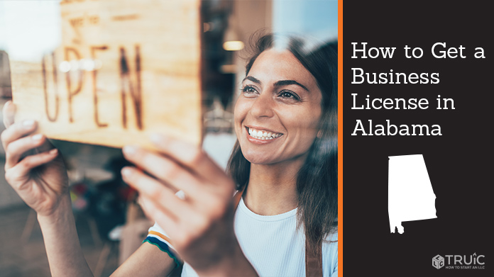 Woman holding open sign after getting her business license