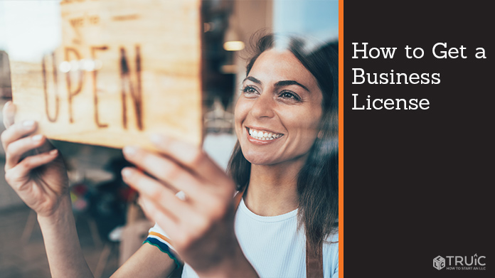 Woman holding open sign after getting her business license