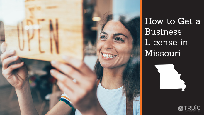 Woman holding open sign after getting her business license