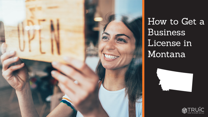Woman holding open sign after getting her business license