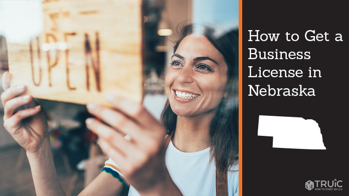Woman holding open sign after getting her business license