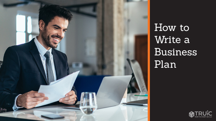 Man writing a business plan.