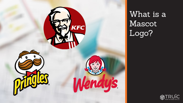 Designer on a computer illustrating a logo