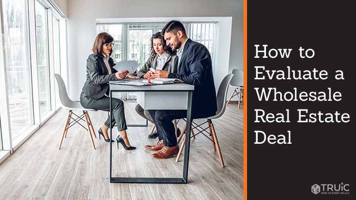 Group of people evaluating a wholesale real estate deal.