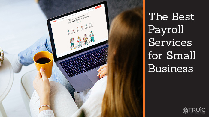 Woman using her payroll software for her business.