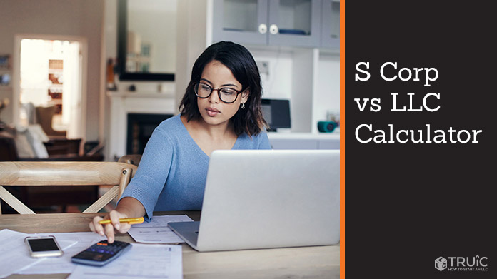 Woman working at her desk on an S corp vs LLC calculator.