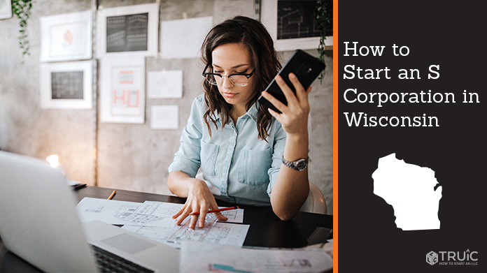Woman looking over paperwork to start an S corporation in Wisconsin