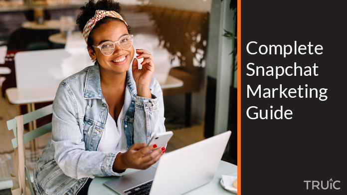 Woman looking at a Snapchat marketing guide.