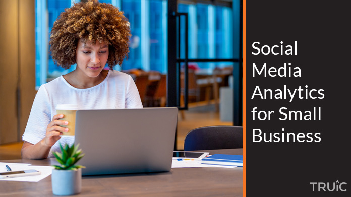 Woman looking at social media analytics for her small business.