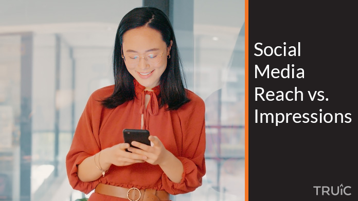 Woman looking comparing her social media reach to her social media impressions.